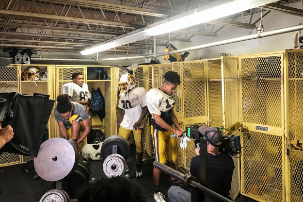 Photo 1: Camera Operator Josh Flannigan captures the Mt. View football team prepping for practice. Photo 2: Jerry Risius captures the action from on the field at Mt. View's homecoming game.