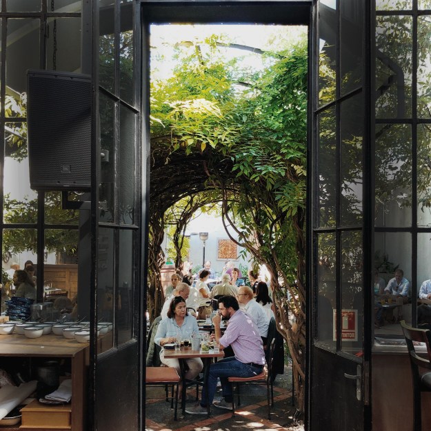 The Escaramuza is a beautiful high-ceiling bookstore and cafe located near Parque Rodo Park.