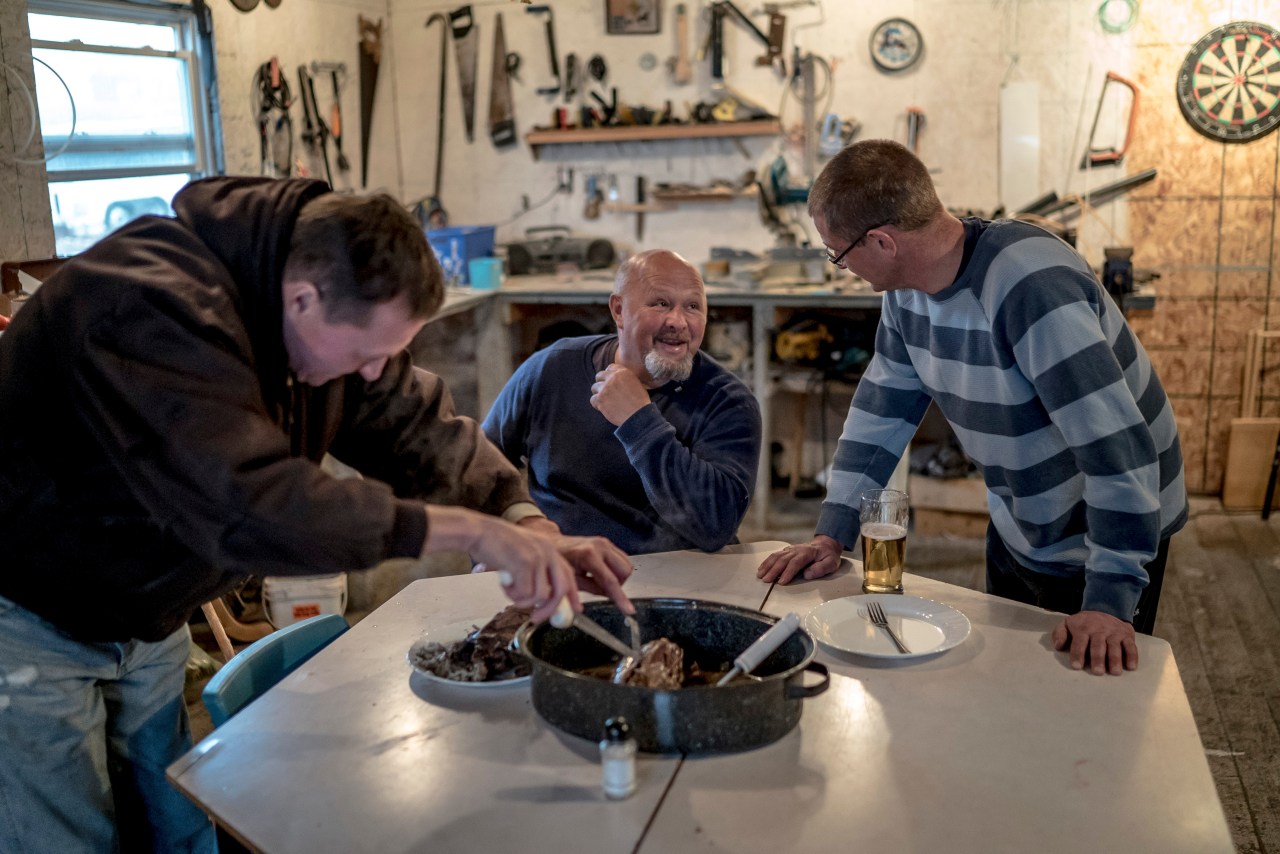 Left to right, Mike Fleming, Jerry Hussey, and Shannon Mound prepare their birds.