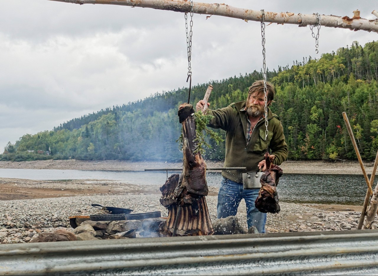 Charles cooking moose meat while shooting Parts Unknown. Photo by Danny Beaser.