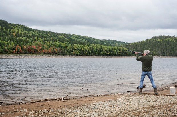 Tony firing a gun in Newfoundland.