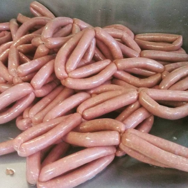 Making sausage at the shop in Renews.