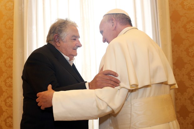 Pope Francis receives President of Uruguay Jose Mujica at his private library in Vatican City, Vatican. By Vatican Pool via Getty Images.