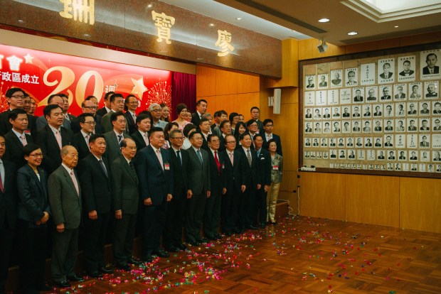 Hong Kong Chiu Chow Chamber of Commerce members celebrate the 20th anniversary of the handover. Photo by Billy H.C. Kwok via Getty Images.