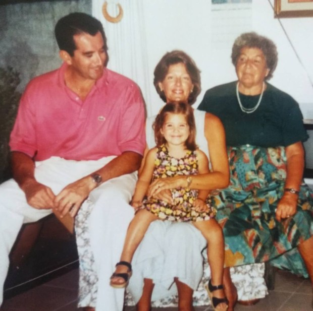 The author (center) in 1993, with her grandmother and parents. Photo courtesy of Lola Méndez.