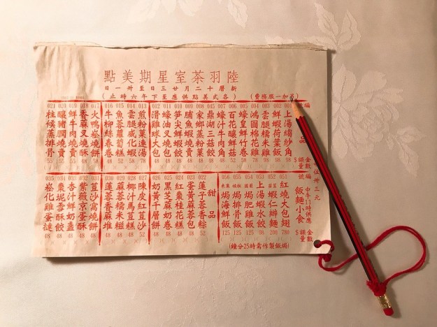 1: Luk Yu Teahouse menu. Photo by Raymond "檸檬黃" H. via Yelp. 2: Dim sum at Luk Yu Teahouse. Photo by Wendy W. via Yelp.