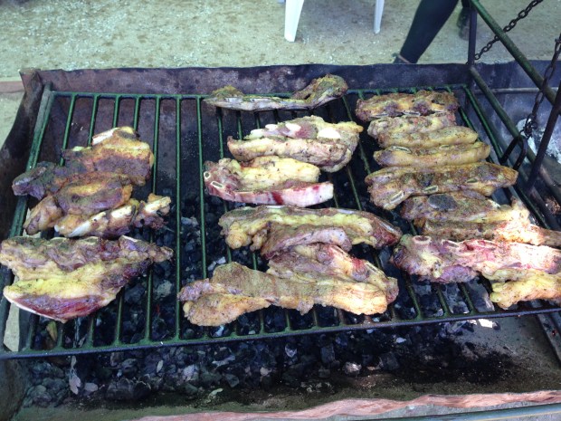 Uruguay’s favorite cut of meat, asado de tira, grilling during a raid.