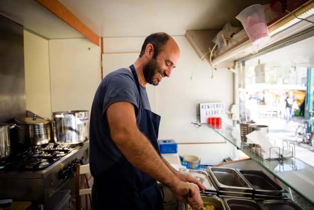 Radwan sells a classic Egyptian street food dish named “koshary” from his food truck in Berlin.