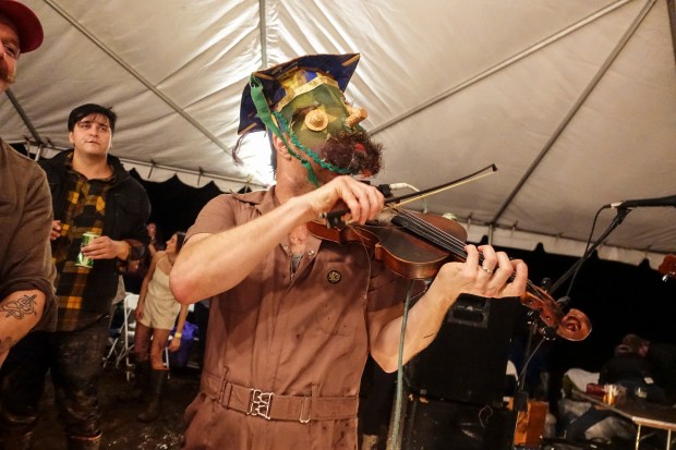 A man plays the fiddle during filming in Louisiana.