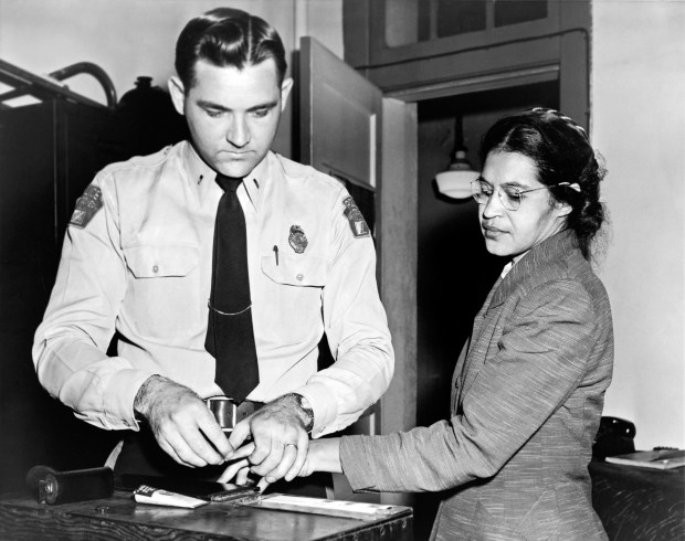 Rosa Parks being fingerprinted during her arrest. Underwood Archives via Getty Images.