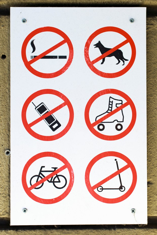 A sign in Berlin of prohibited activities. Photo by Michael Gottschalk/Photothek via Getty Images.