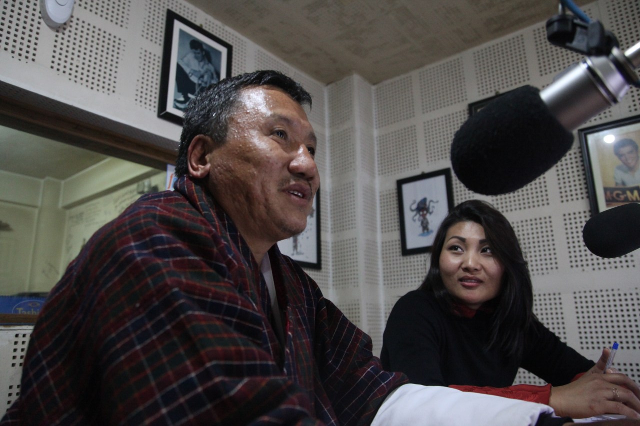 Dr. Chencho Dorji and Namgay Zam record an episode of Mind Over Matter Bhutan in the studio at Radio Valley in Thimphu.