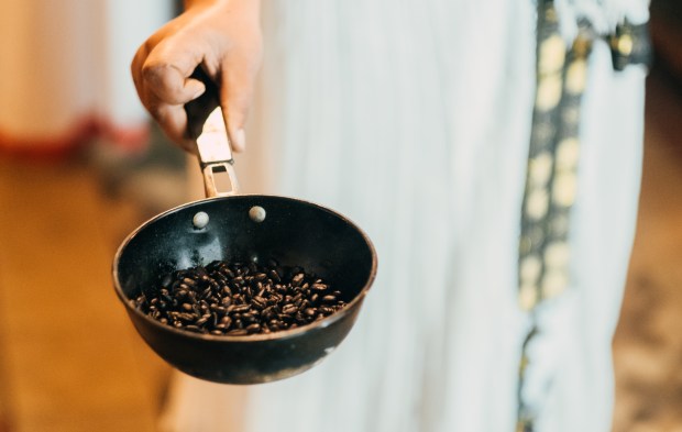 Beans are washed and roasted over medium heat.