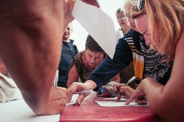 People sign up ahead of a protest.