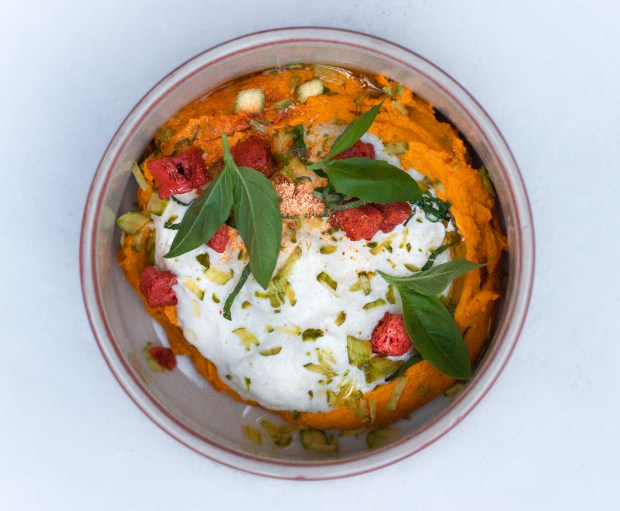 Burrata with carrot and pistachio hummus. Photo by Anna Rylova.