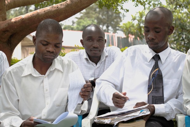 The church’s choir, which never seems to stop practicing, reads over their notes after a Sunday service.