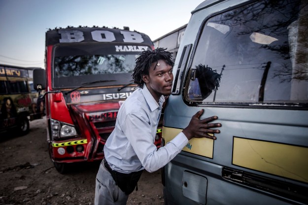 Image result for kenyan matatu conductor picking fare