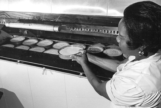 A woman bakes Boston cream pies in 1965. Photo By Dave Buresh / The Denver Post via Getty Images.