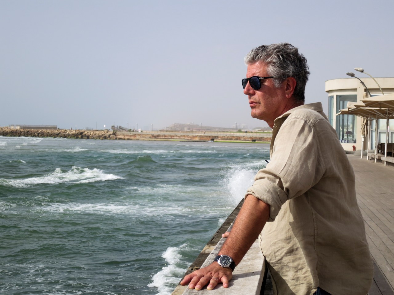 Bourdain on the coast of Tel Aviv, Israel.