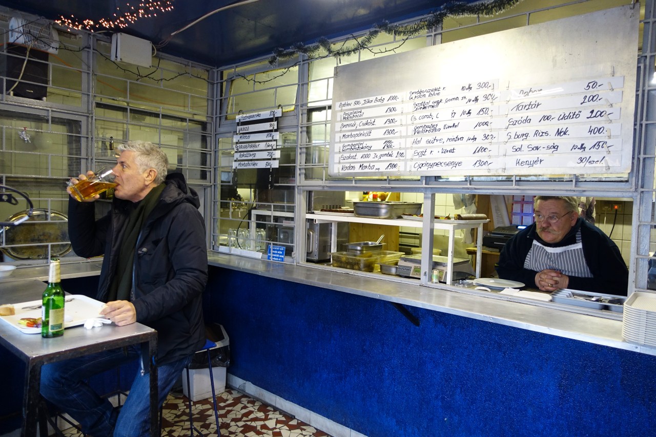 Tony enjoys a beer with his venison stew and schnitzel at Pléh Csárda in Budapest.