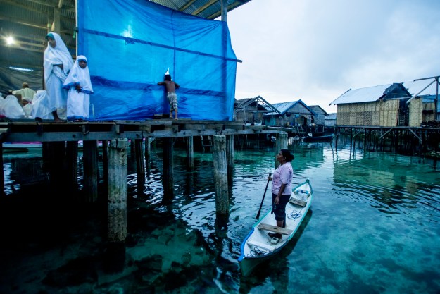 1. Though a majority of Bajau now live in stilt communities, they still build their mosques over the ocean. They practice a syncretic belief system that allows for a deep reverence for the ocean and the spirits that are said to inhabit it. 2. Night time prayers at a mosque on stilts over the ocean.