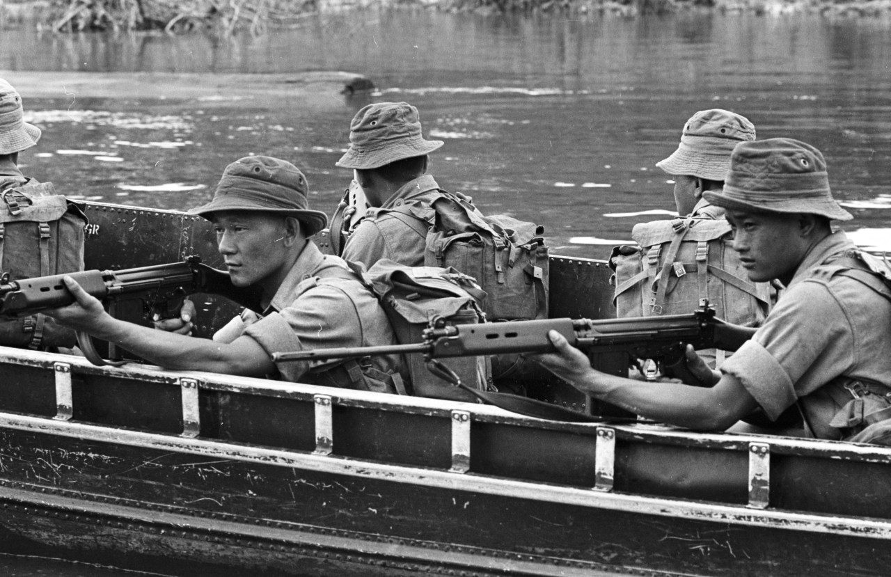 British soldiers on a boat in Borneo on March 11, 1965. Photo by Stan Meagher/Express via Getty Images.