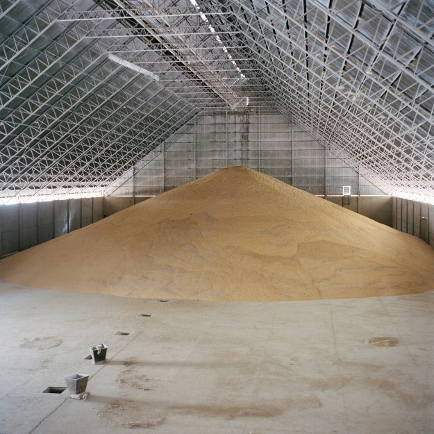 1: A silo of corn at Puerto Gical, one of the main ports on the river Paraguay near Asunción. 2: Soya and maize seeds Semillas Veronica.