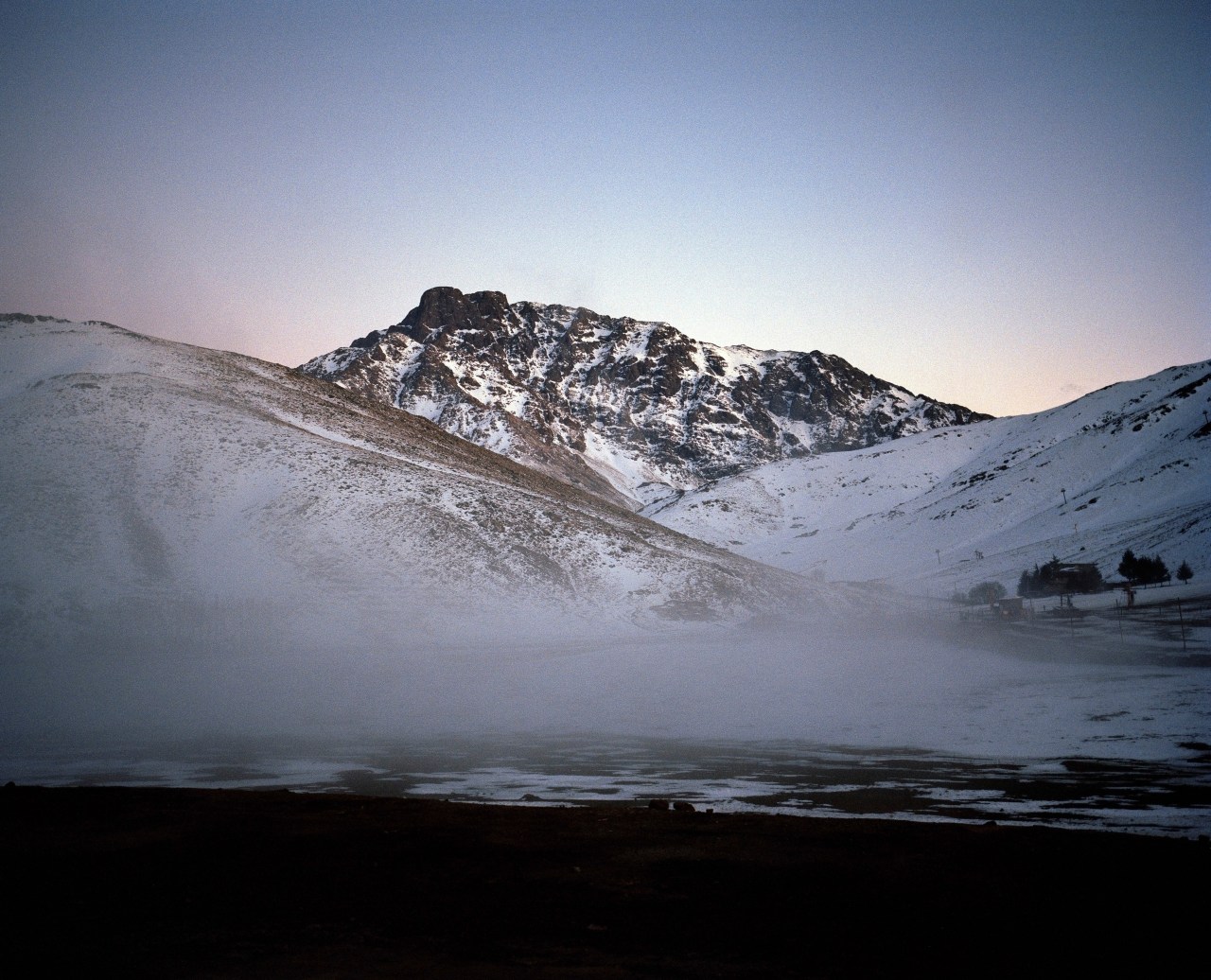 The evening light fades over Mount Angour.