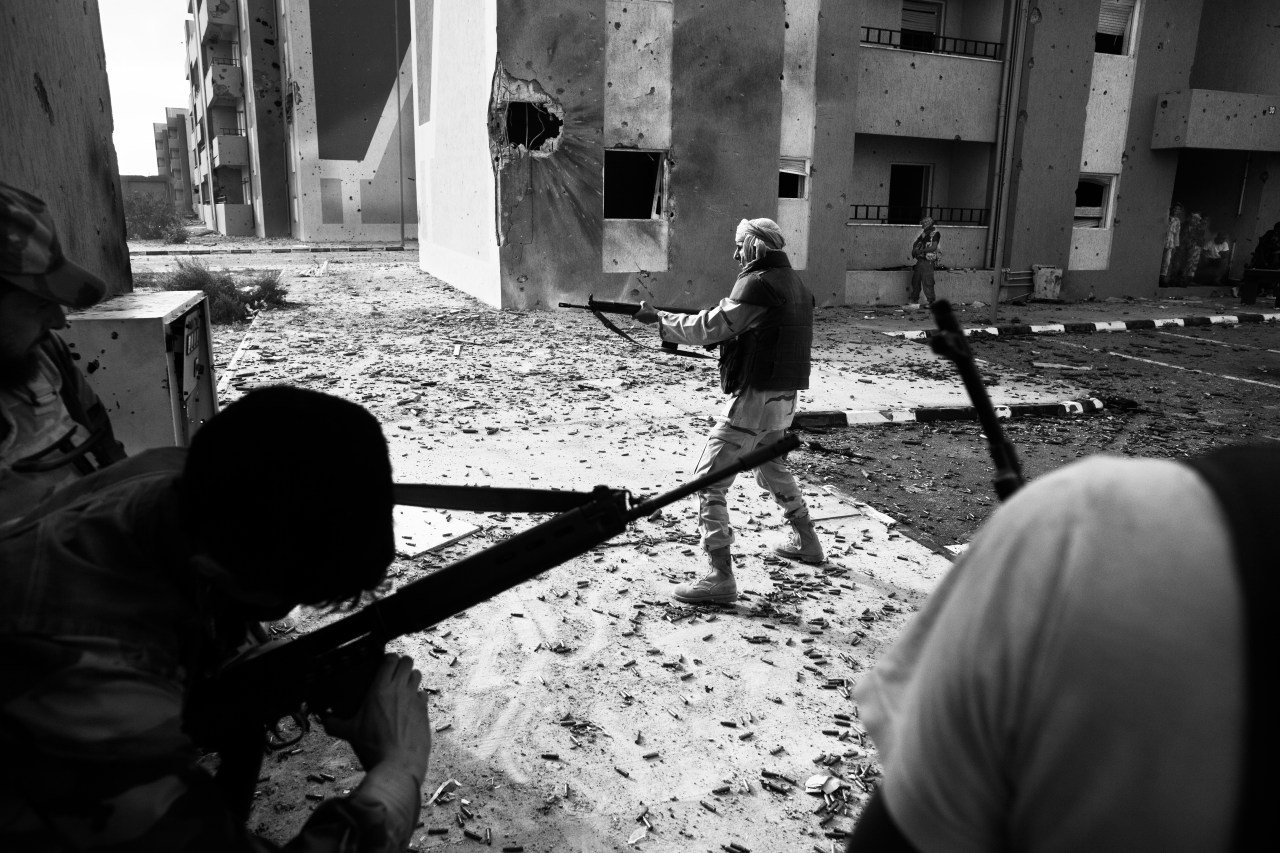 Rebel soldiers fighting against loyalist troops in the Mauritania district of Sirte - October 2011.