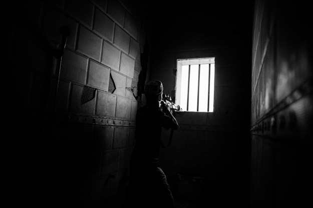 1: A member of the Libyan forces fires his rifle towards ISIS positions at a frontline in Sirte - October 2016. 2: Buildings damaged by weeks of airstrikes in Sirte - September 2016.
