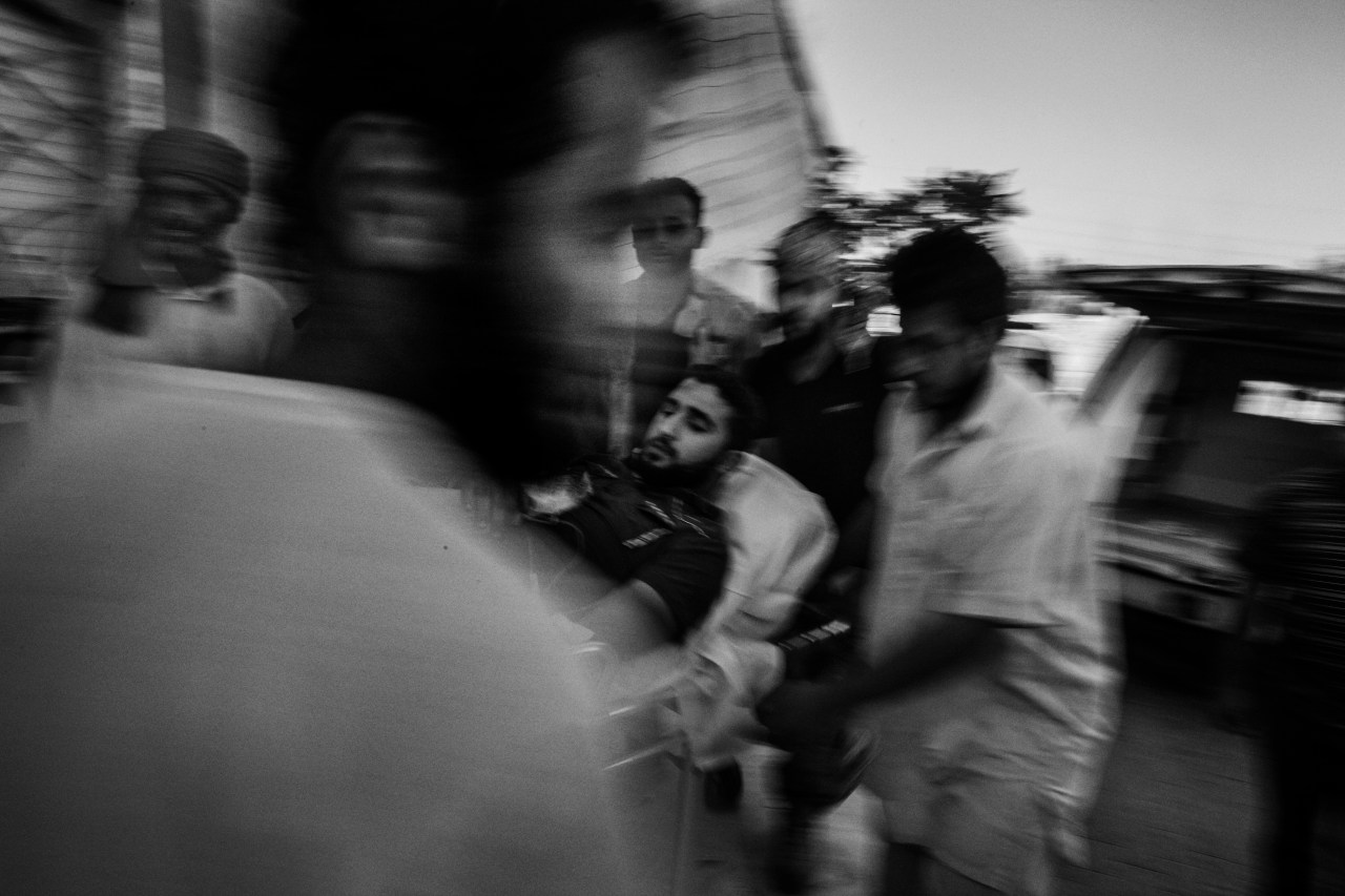 A wounded member of the Libyan forces is brought to a field hospital during fighting with ISIS in Sirte - September 2016.