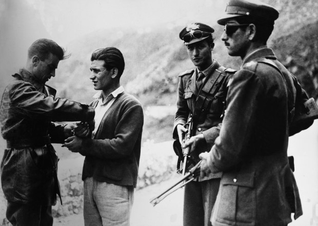 Carabinieri checking s suspect in Sicily. Photo by Keystone-France/Gamma-Keystone via Getty Images.